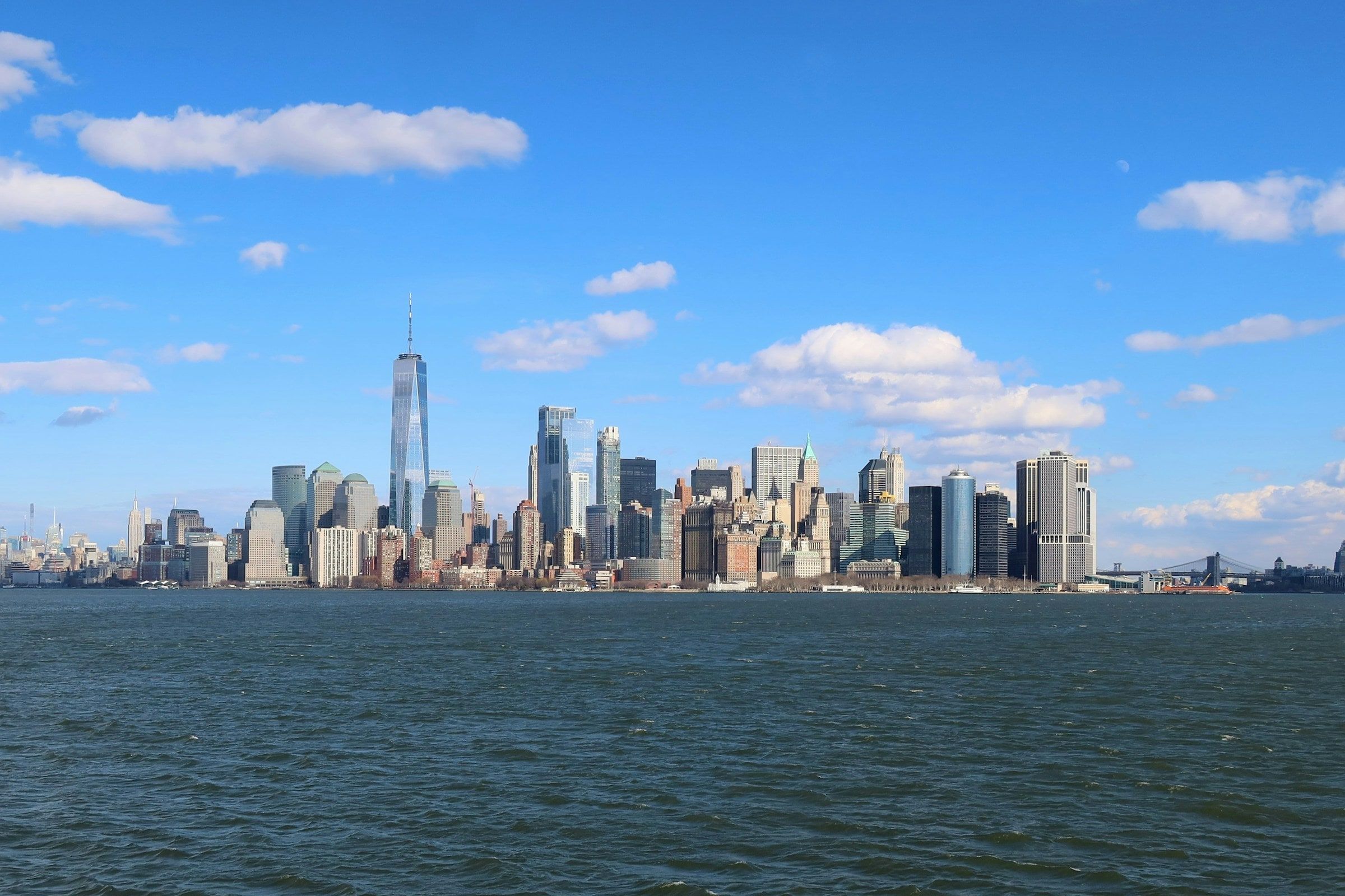 Lower Manhattan's skyline and One World Trade Center seen across New York Harbor.